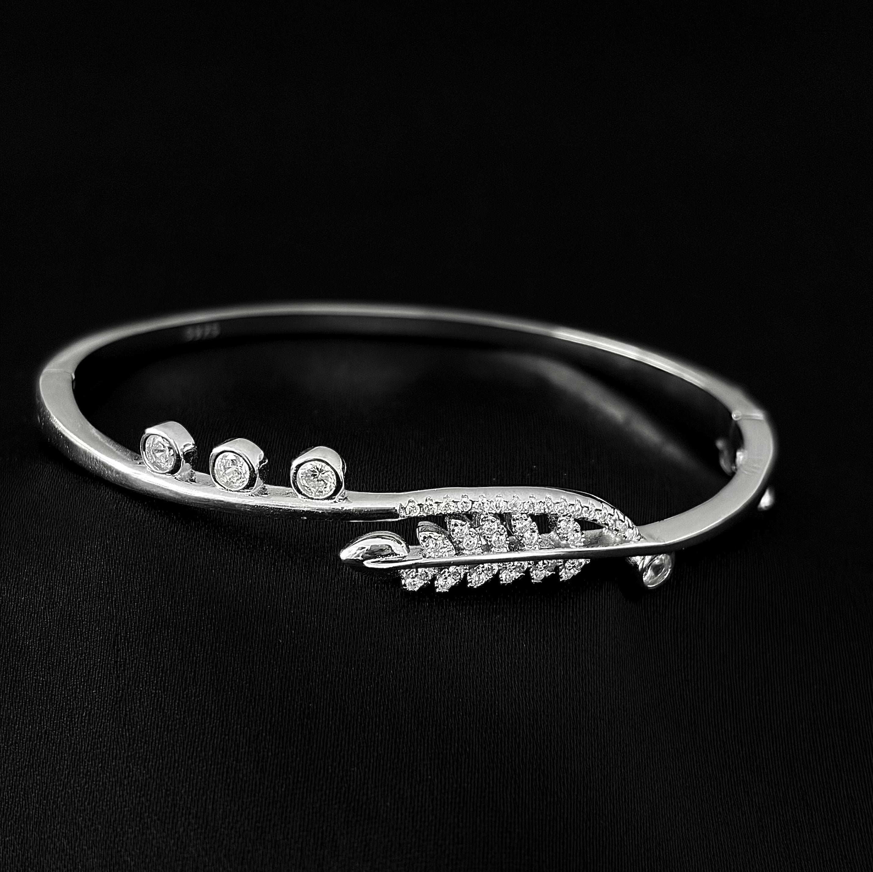 Graceful Feather Sterling Silver Bangle with Sparkling Stone Accents