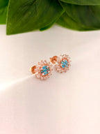 Radiant Blue Crystal Burst Stud Earrings in Rose Gold Tone