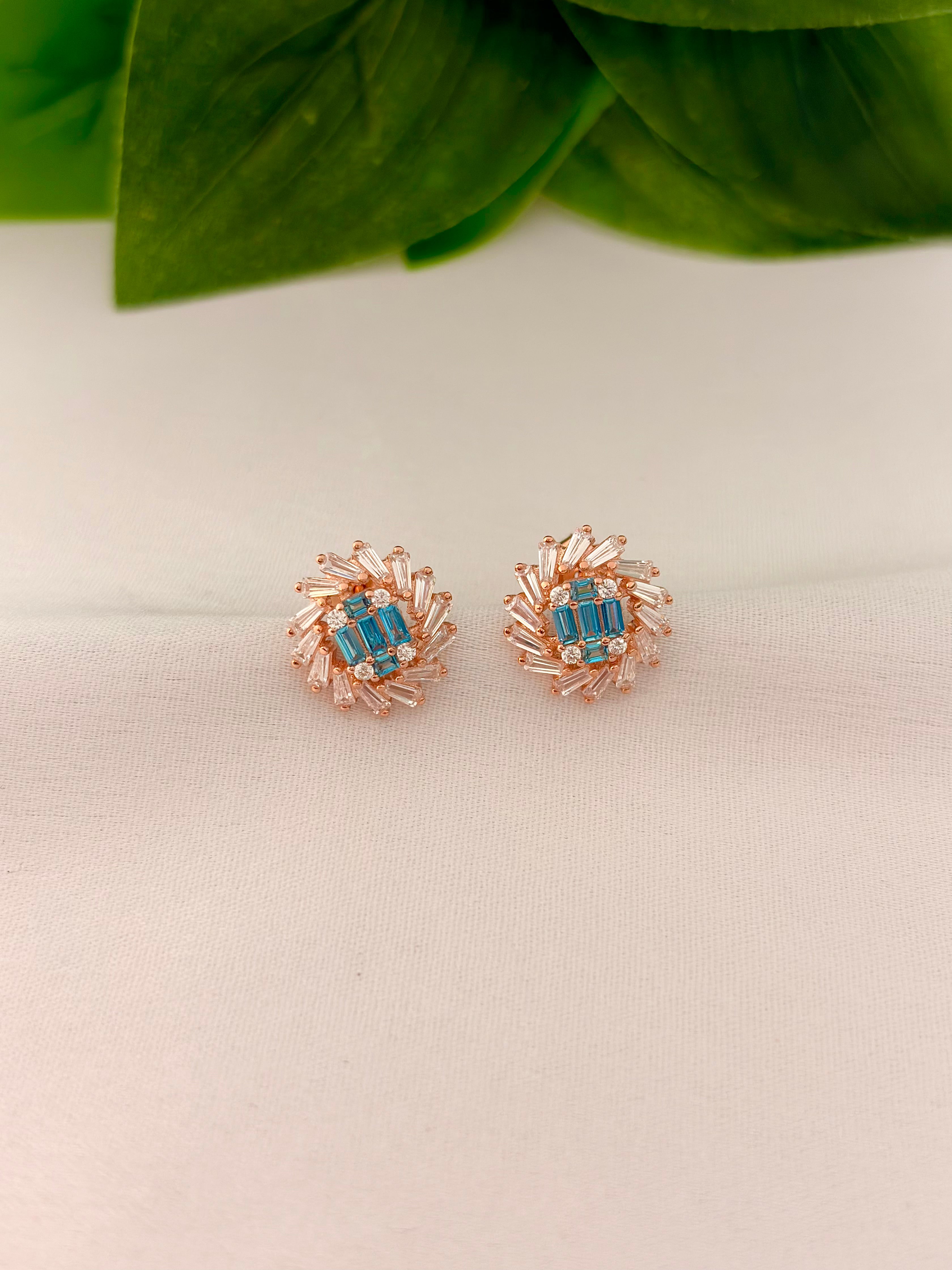 Radiant Blue Crystal Burst Stud Earrings in Rose Gold Tone