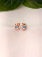 Elegant Blue Baguette Oval Halo Stud Earrings in Rose Gold Tone