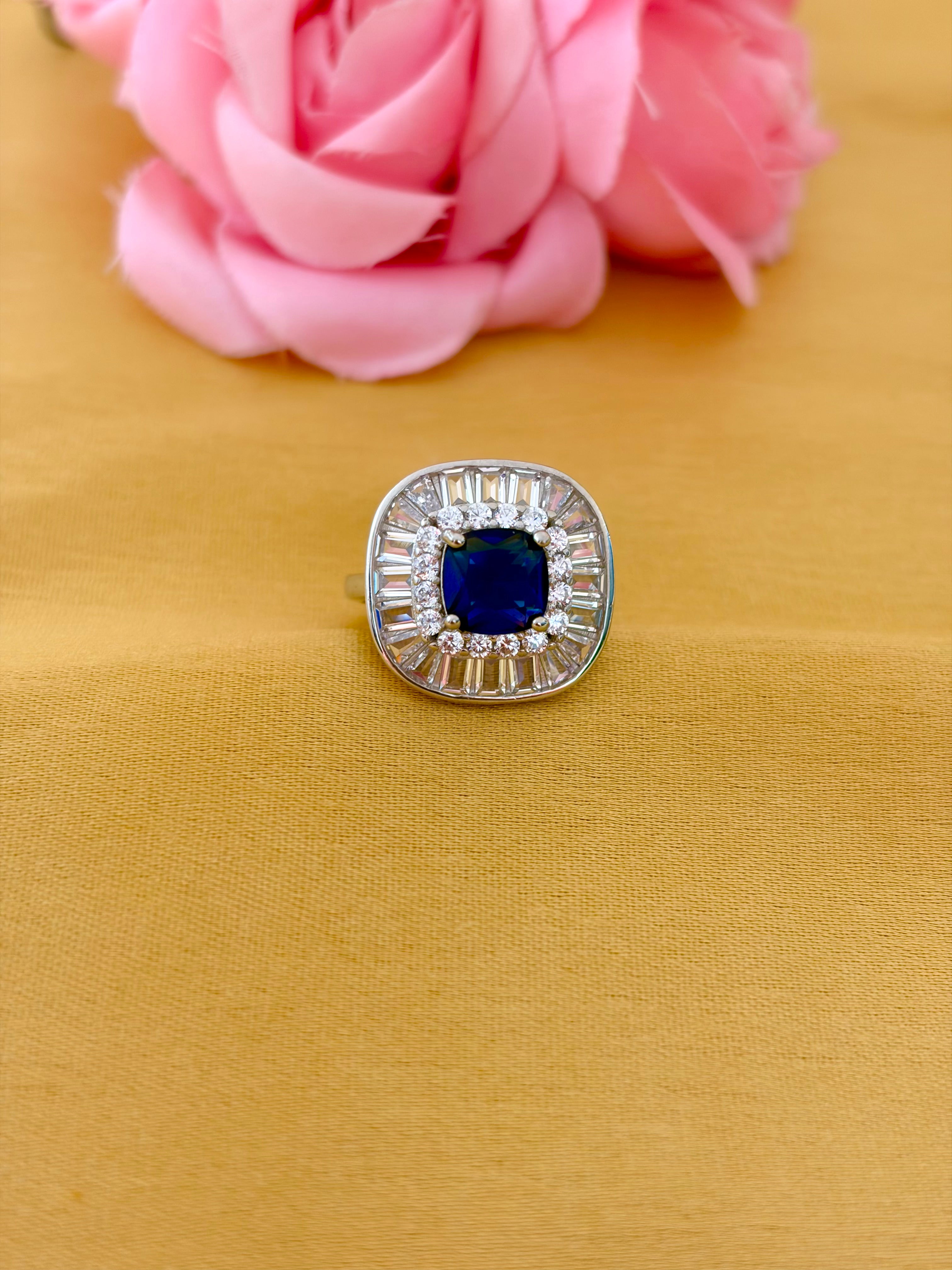 Sophisticated Sapphire Halo Ring with Baguette Diamond Frame