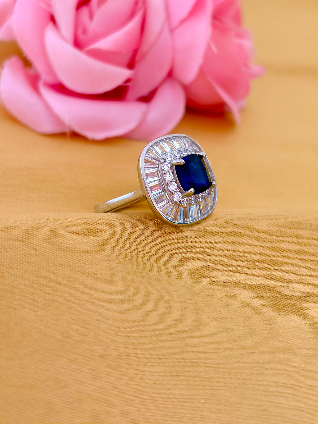 Sophisticated Sapphire Halo Ring with Baguette Diamond Frame