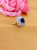Sophisticated Sapphire Halo Ring with Baguette Diamond Frame