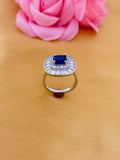 Sophisticated Sapphire Halo Ring with Baguette Diamond Frame