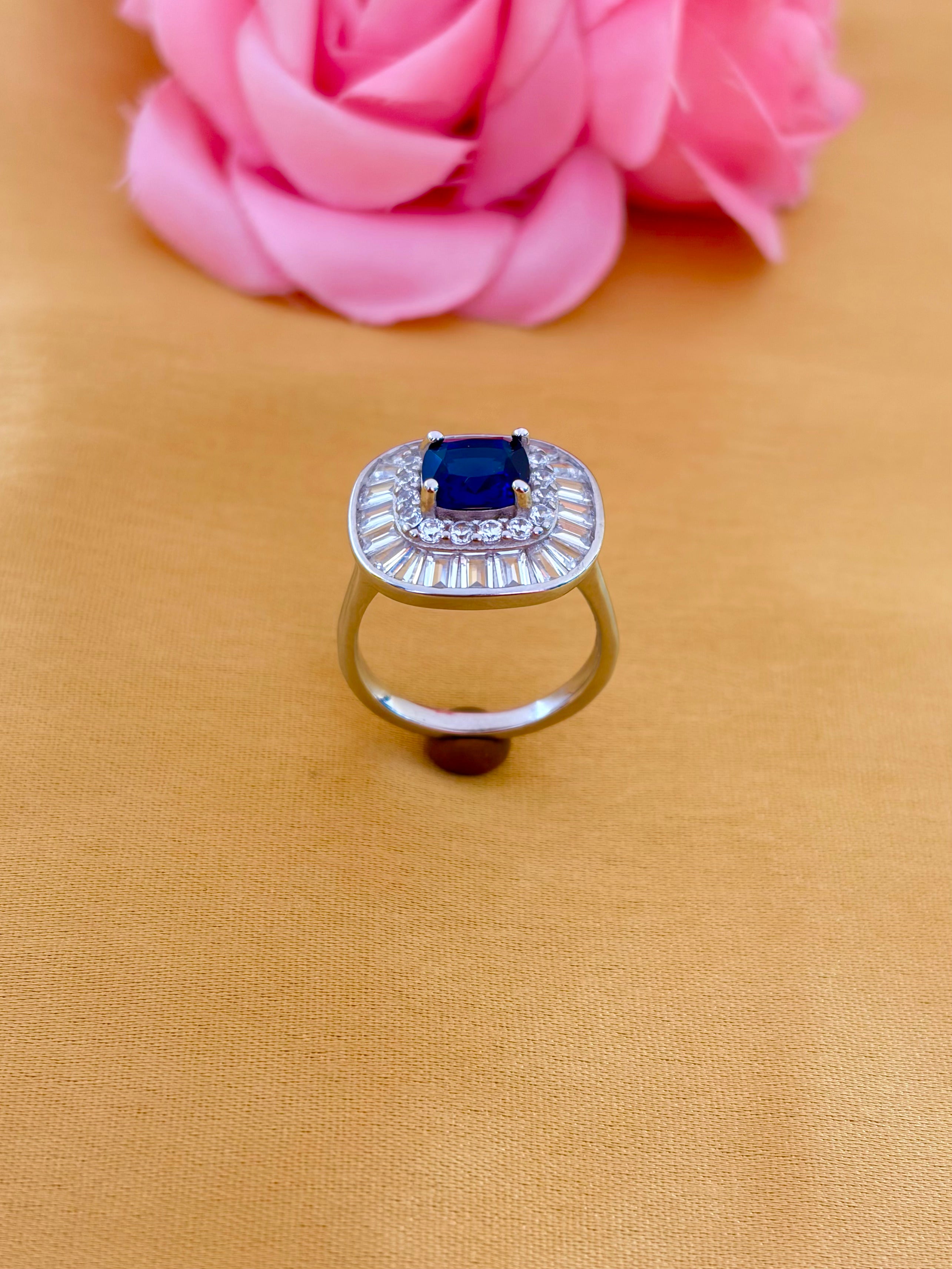 Sophisticated Sapphire Halo Ring with Baguette Diamond Frame