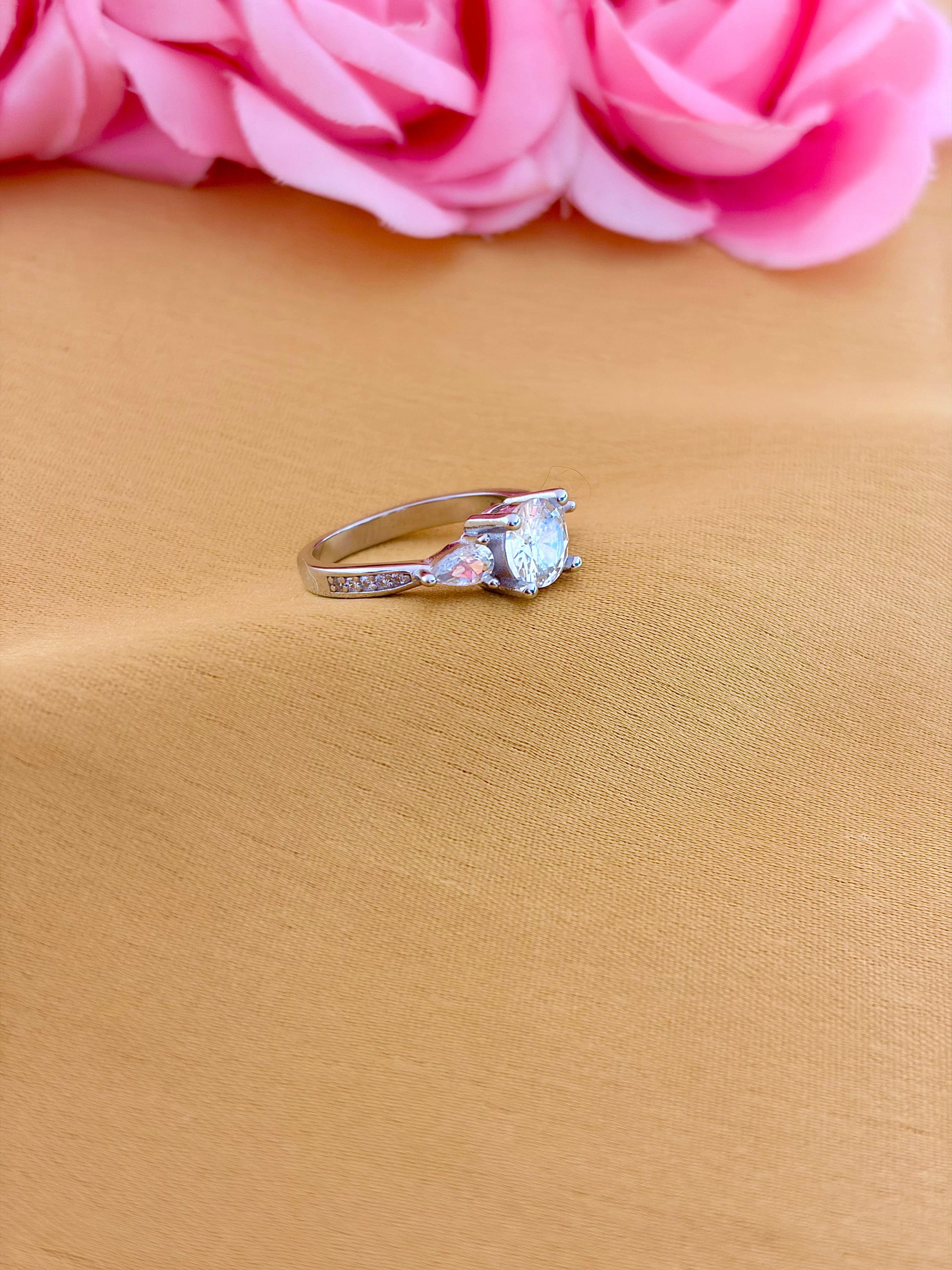 Raised Solitaire Side-Stone Ring